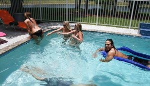 18 year old girl Megan Rain removes her sandals and then clothes to pose naked